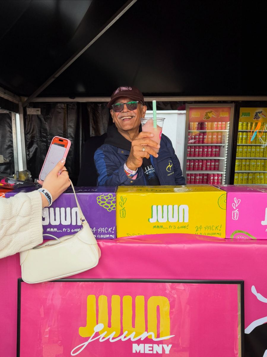 Smiling vendor at the JUUN booth